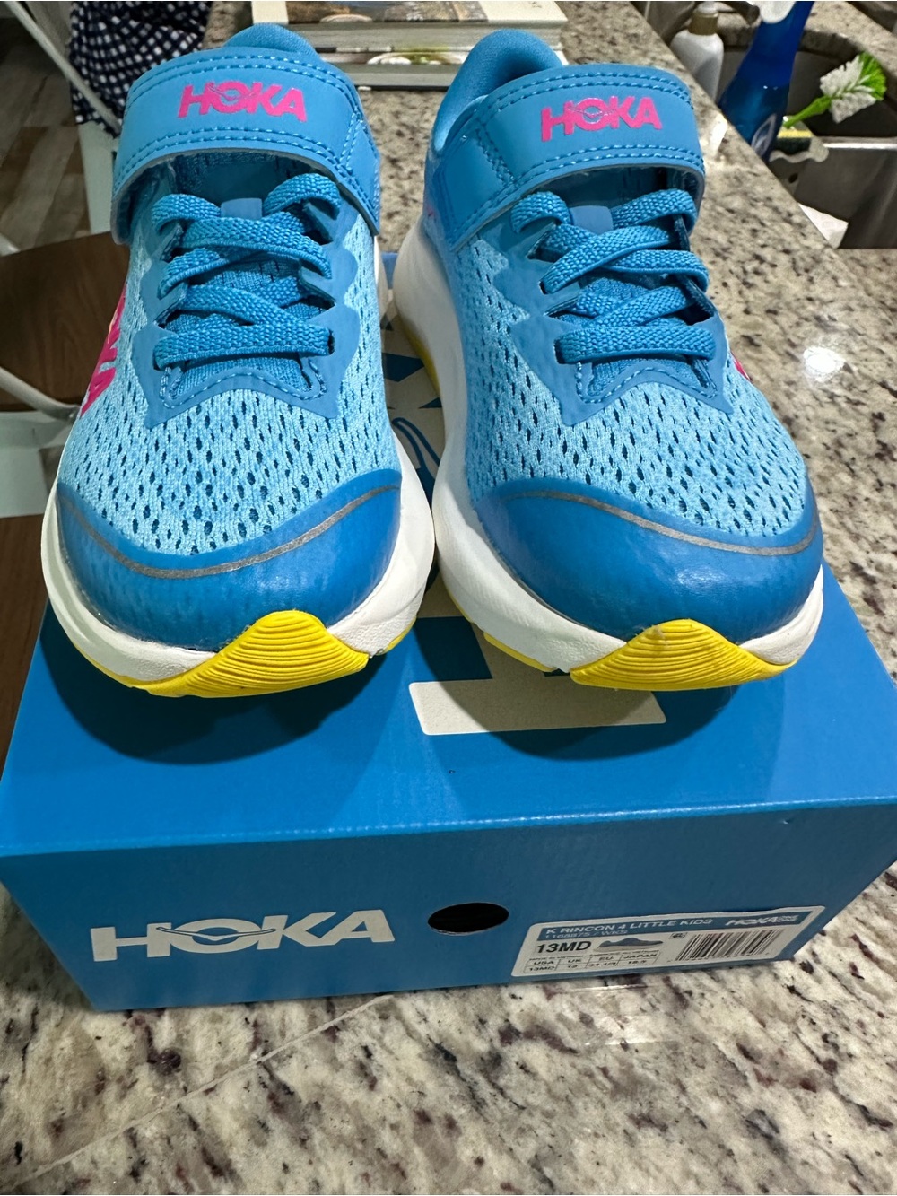 Hoka One One Kids Blue Sneakers with Pink Logo and Yellow Accents